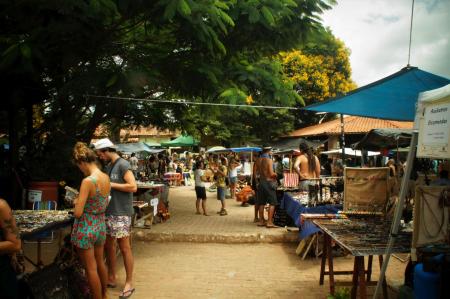 Various market stalls and people browsing the products