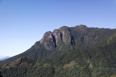 Impressive rock formations and lush green hills – remnants of ancient volcanic activity in Brazil.